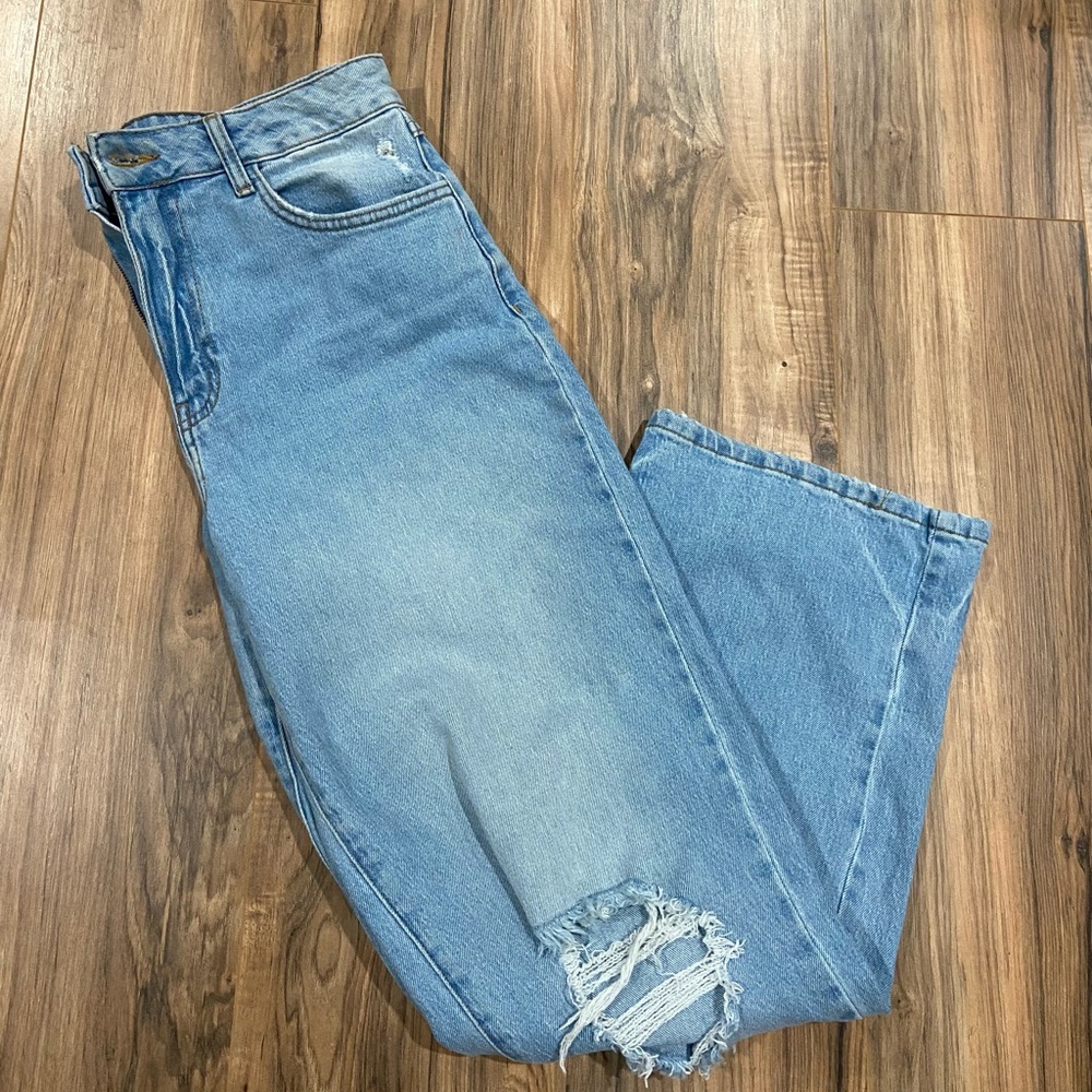 Light blue ripped flare jeans